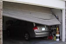 I just backed into my garage door. What should I do?