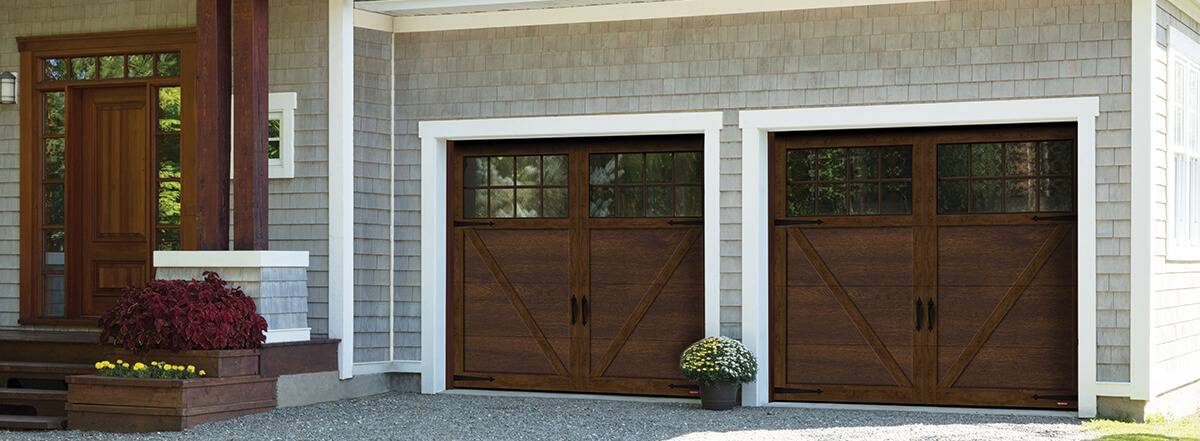 Carriage house style garage doors model Princeton in chocolate walnut color with large Panoramic glass windows on top